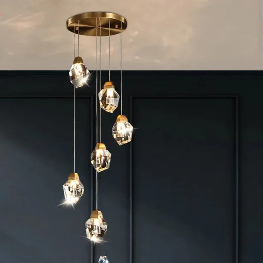 A golden hanging LED crystal lamp with lighting fixtures Yahav's home lighting